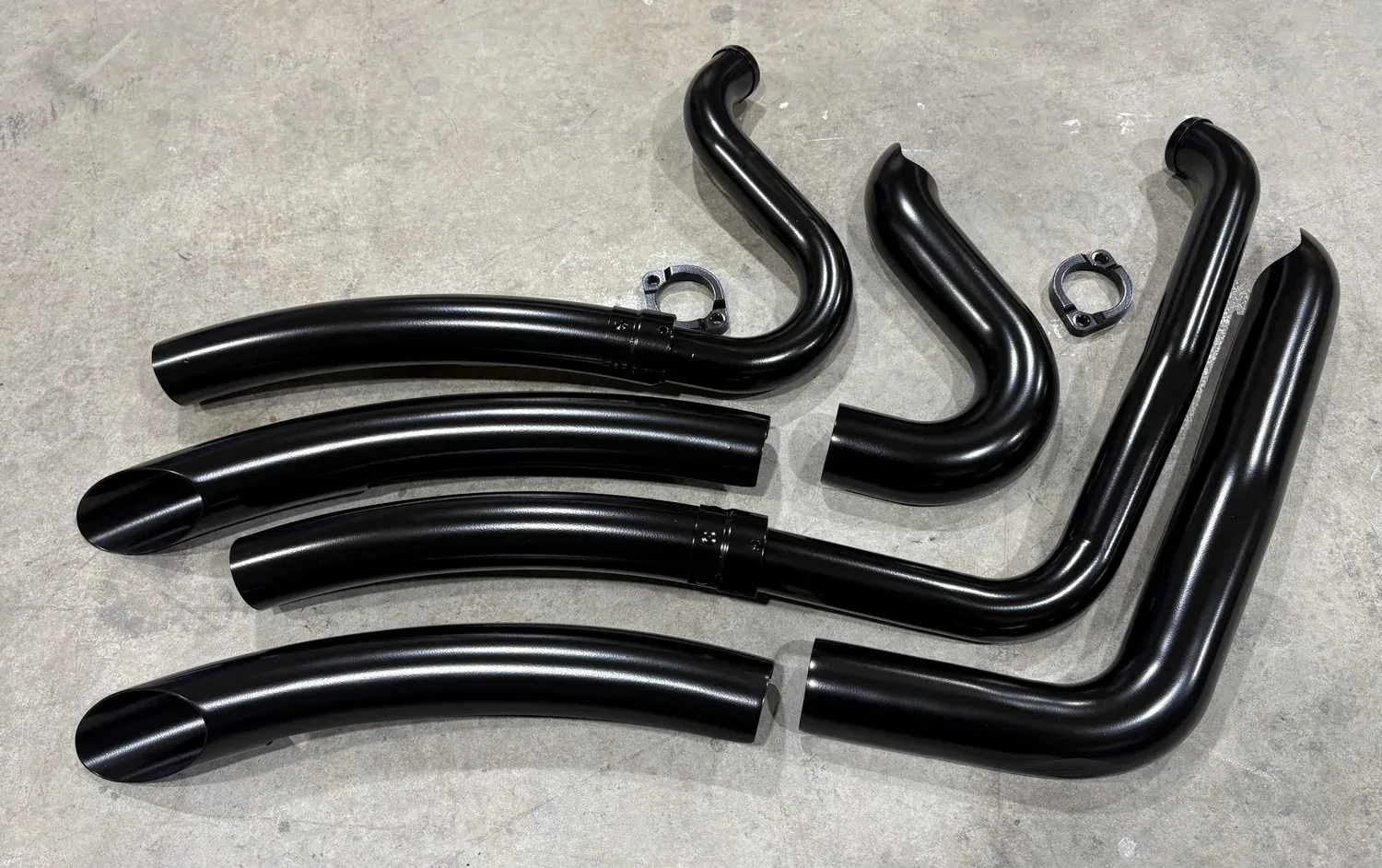 Set of motorcycle exhaust header pipes finished in gloss black