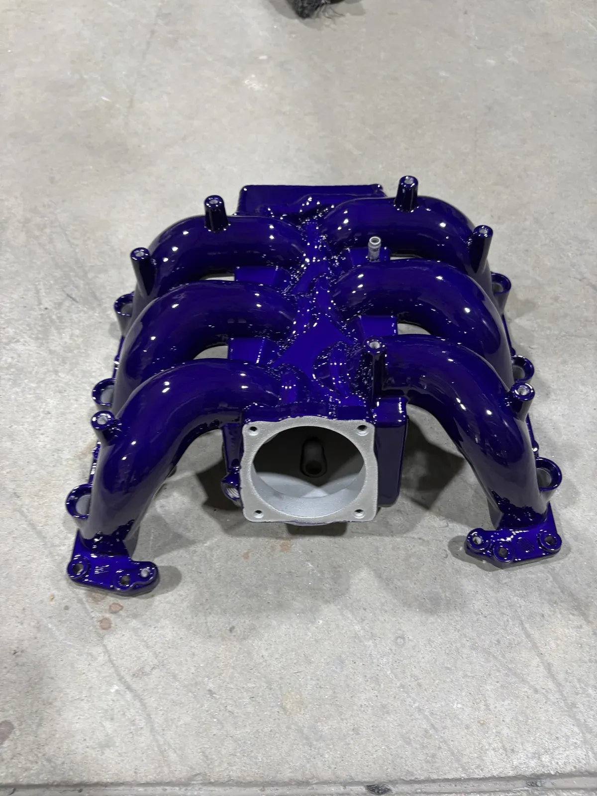 Intake manifold in deep purple metallic with the throttle body flange masked off to stay bare